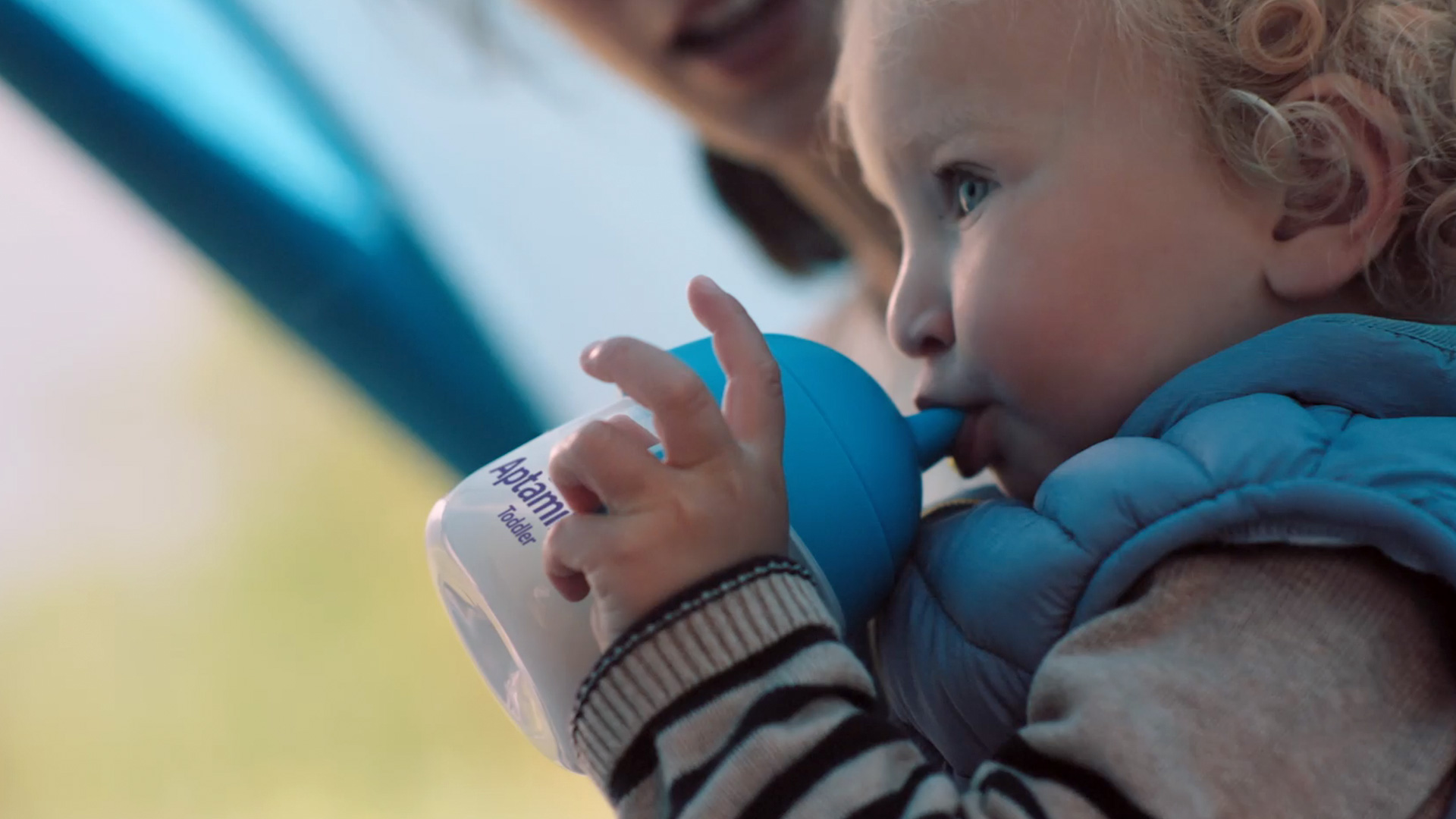 Toddler drinking from a sippy cup