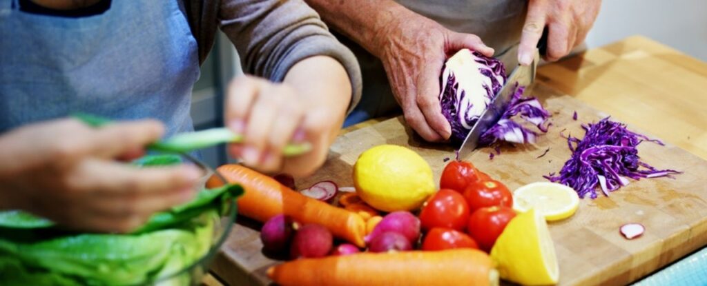 Chopping fresh ingredients in the kitchen.