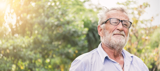 Senior man standing outside