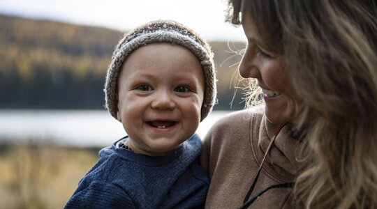 smiling child with mother